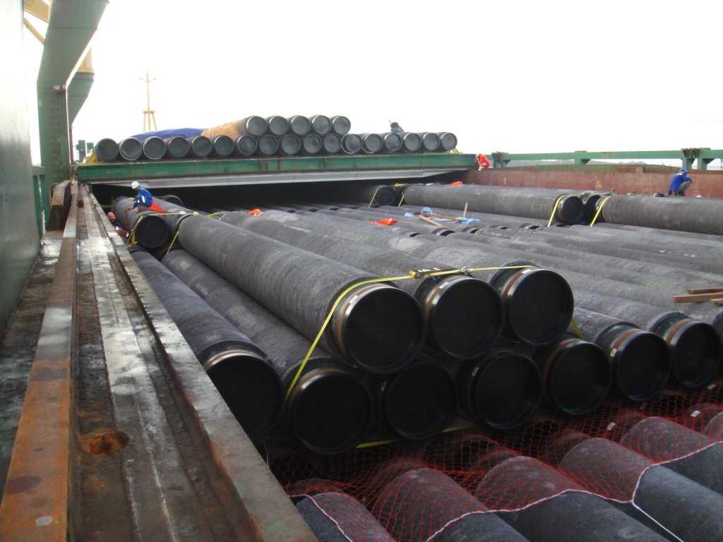 Pipes stacked on a cargo barge